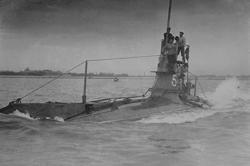 Royal Navy British Submarine A5 on Coast with Navy Men on Conning Tower above surface