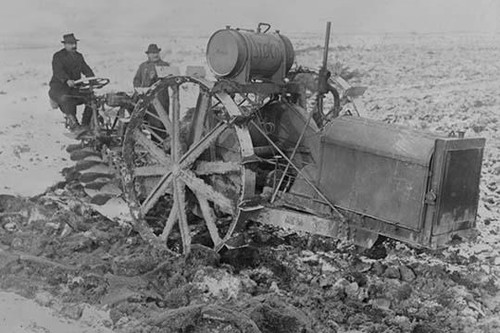 German Designed Huge Tractor digs for unearths potatoes.