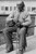 Portrait of an Male Ex-Slave Sitting in Chair & Smoking