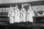 Four Hooded White Sheeted Ku Klux Klan Member pose in Robes & Hoods in front of Airplane