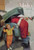 Boy Upset to See Santa Mechanic under Car Hood