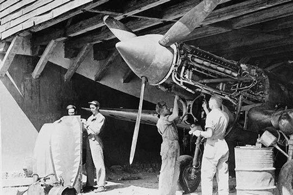 Ground crews of American Air Forces keep the engines tuned up for the Flying Tigers.