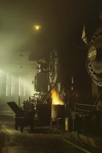 Photo of Fronts of Steam Engine Locomotives on Factory Floor