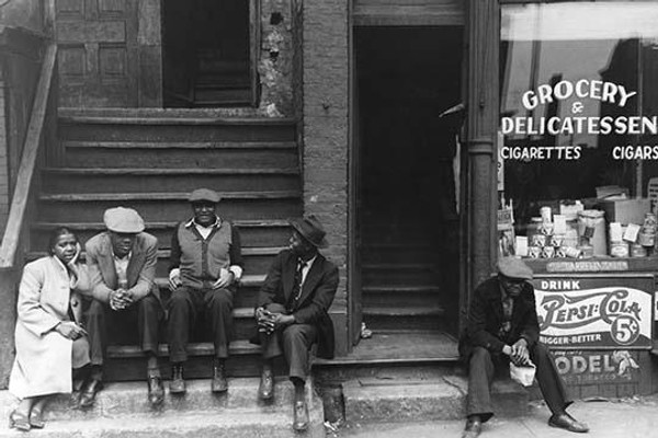 People sitting on front porches in Negro section of Chicago, Illinois
