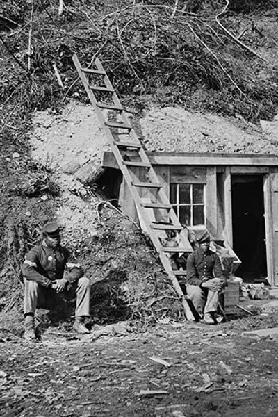 African American soldiers watch over a bomb proof shelter