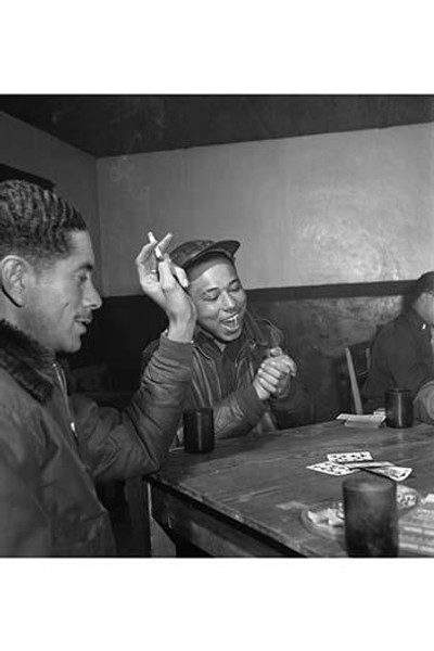 Tuskegee airmen playing cards in the officers' club in the evening