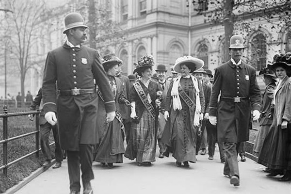 Suffragettes, preceded by policemen, leaving City Hall, New York
