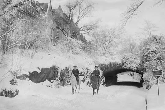 Two Horseback Riding during a Snowfall in Manhattan's Central Park