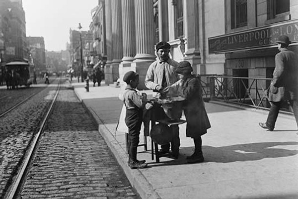 Boys buy peanuts from Street Vendor of 42nd street. NYC