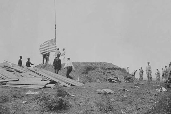 Hoisting the flag at Guantanamo, June 12, 1898