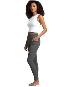 Grey  buttery soft yoga leggings.  The High Waisted Pocket Leggings sculpt and smooth fabric. Featuring dual side pockets and targeted compression these leggings deliver performance comfort from studio to street.