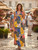 When the days get long and hot, this dress has you covered. It’s a summer dream come true, with a deep V-neck and sleeveless arms to keep you cool. The vibrant patchwork pattern combines floral and geometric prints with a dash of boho chic. It’s perfect for a casual summer party and versatile enough for a shopping trip, a day at the beach, or just running errands.