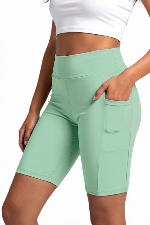 Green gym shorts. Those shorts are designed for ladies that are super active and fashionable. Stretch and cool comfort workout biker shorts. Great Bermuda shorts for riding your bike, running or attending yoga class.  Ideal length - 8.5" provides control of coverage yet allows you to freely move and exercise. Perfect for your vacation gateway. You will love how great those feel on your skin. Pockets on both sides