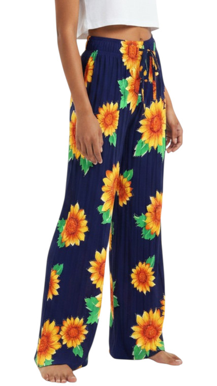 Classic Navy  Sunflower all over summer pants . Elevate your wardrobe with those Women's Shiny Sparkles Pleated Palazzo Pants. Designed to combine comfort and style, these pants feature a high-rise elastic waist with a drawstring closure, ensuring a snug and flattering fit. The wide-leg silhouette offers a relaxed and fluid look, perfect for various occasions from business to formal events, or even for casual outings. Crafted from a lightweight blend of 65% cotton and 35% polyester, these pants are not only breathable but also stretchable, providing the flexibility you need throughout the day.
