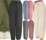 Our winter sweatpants for women are super thick and cozy. They are made of cotton and polyester with a thick Sherpa fleece lining, and are buttery soft to the touch. They have an elastic waist with a drawstring, and two big side pockets to hold your keys or phone. They are a great gift for the women in your life.