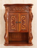 Custom mahogany over-the-toilet bathroom cabinet