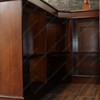 Elegant mahogany corner bar with liquor display