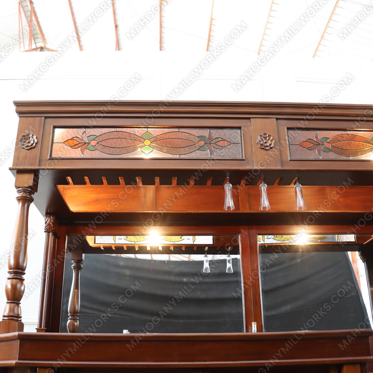 Elegant mahogany corner bar with liquor display
