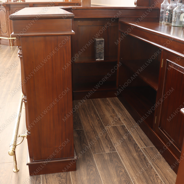 Elegant mahogany corner bar with liquor display