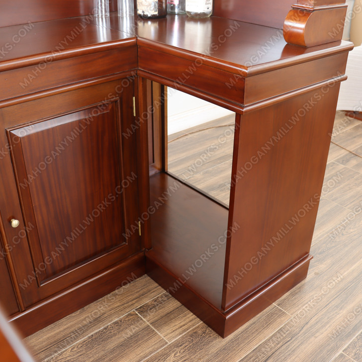 Elegant mahogany corner bar with liquor display