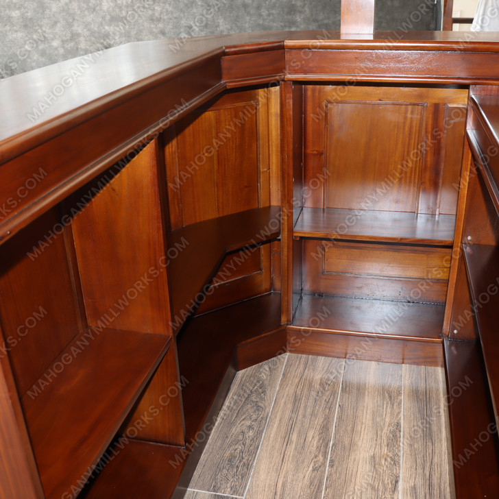 Elegant mahogany corner bar with liquor display