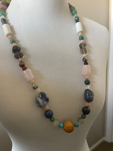 A center bead of Aventurine Quartz with blue Sodalite (Canadian Lapis). A center bead of Aventurine Quartz with blue Sodalite (Canadian Lapis).