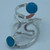 Silver plated ring. Adjustable. With simulated turquoise accents.