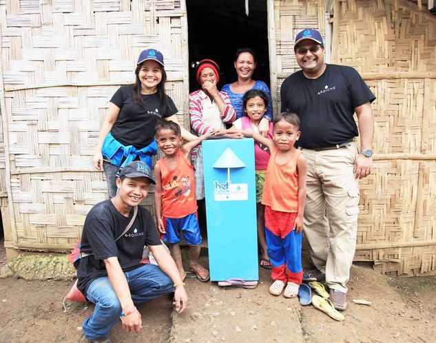 Community members with a Grosche Safe Water Project biosand filter