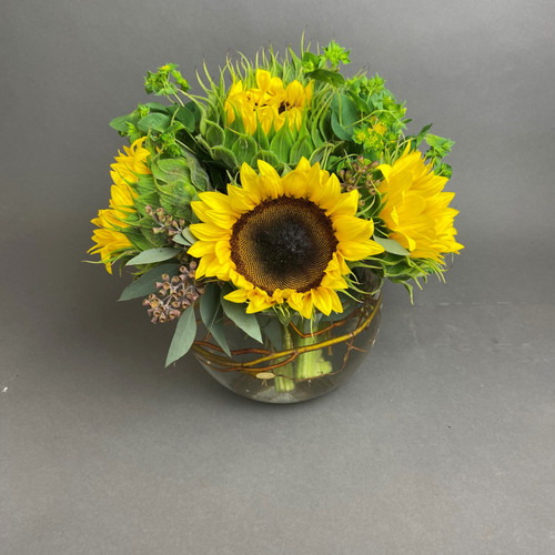 SUNFLOWERS IN A GLASS BOWL