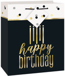 Black and gold Happy Birthday gift bag with elegant lettering, confetti accents, and a matching gift tag.
