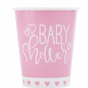 Close-up of pink hearts design on paper cups