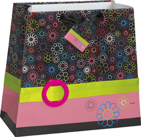Polka dot gift bag with colorful ribbon accent and gift tag.