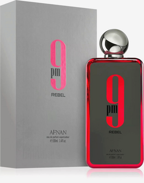 The 9 PM Rebel Eau de Parfum 100ml bottle features a sleek and modern design. Its deep red hue reflects the boldness of the fragrance, while the minimalist labeling adds a touch of sophistication, making it a standout addition to any collection.