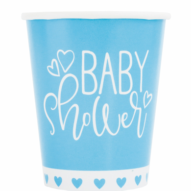 Close-up of blue heart design on paper cups