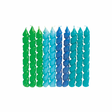 Green and blue birthday candles arranged for cake decoration