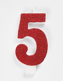 Decorative glitter number 5 candle for birthdays.