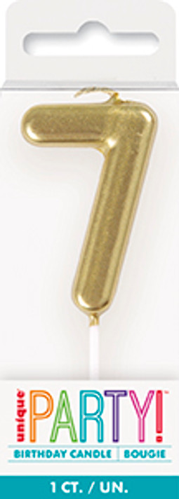 Gold number 7 birthday candle on pick cake topper