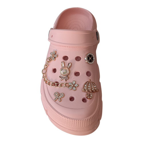 Pastel light pink platform clog slippers decorated with elegant gold chains and diamond-like charms