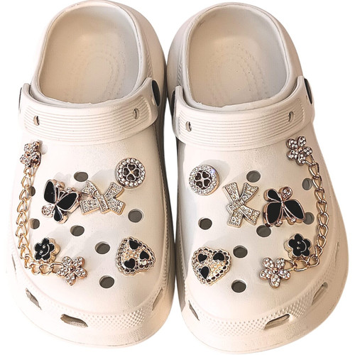 Off-White Butterfly & Heart Charm Clog – A clean, ivory classic elevated by luxurious rhinestone butterflies and golden hardware.
