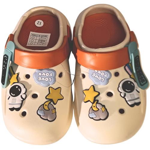 Stylish neutral beige clogs with high-density EVA foam and whimsical 3D astronaut and star details.