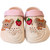 Minimalist beige kids summer clogs pairing a soft blush pink ankle strap with colorful 3D strawberry bear accents.