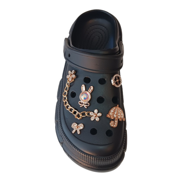 Women’s chunky black platform clogs adorned with luxury gold chains and sparkling rhinestone charms