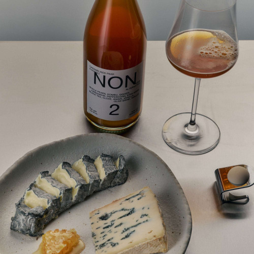 NON 2 paired with fine cheeses on a modern table setting