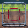 Large rebounder with silver frame and red target on field front the front