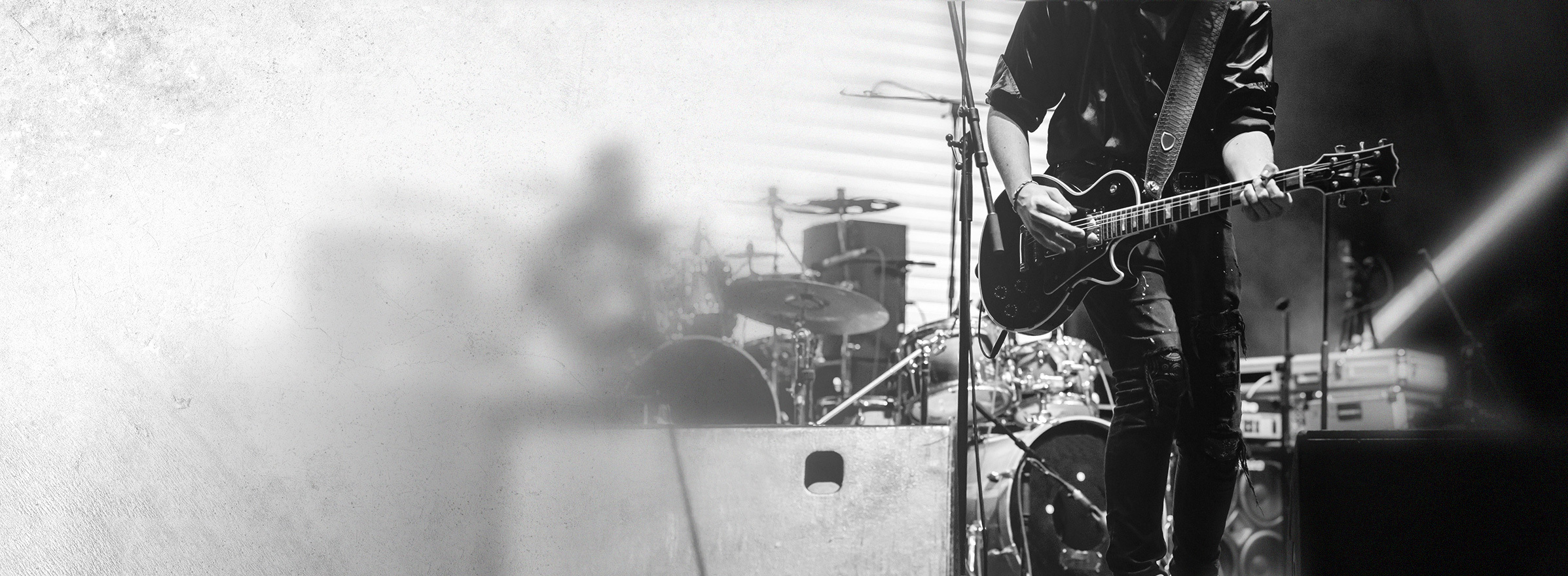 Professional musician with guitar on stage