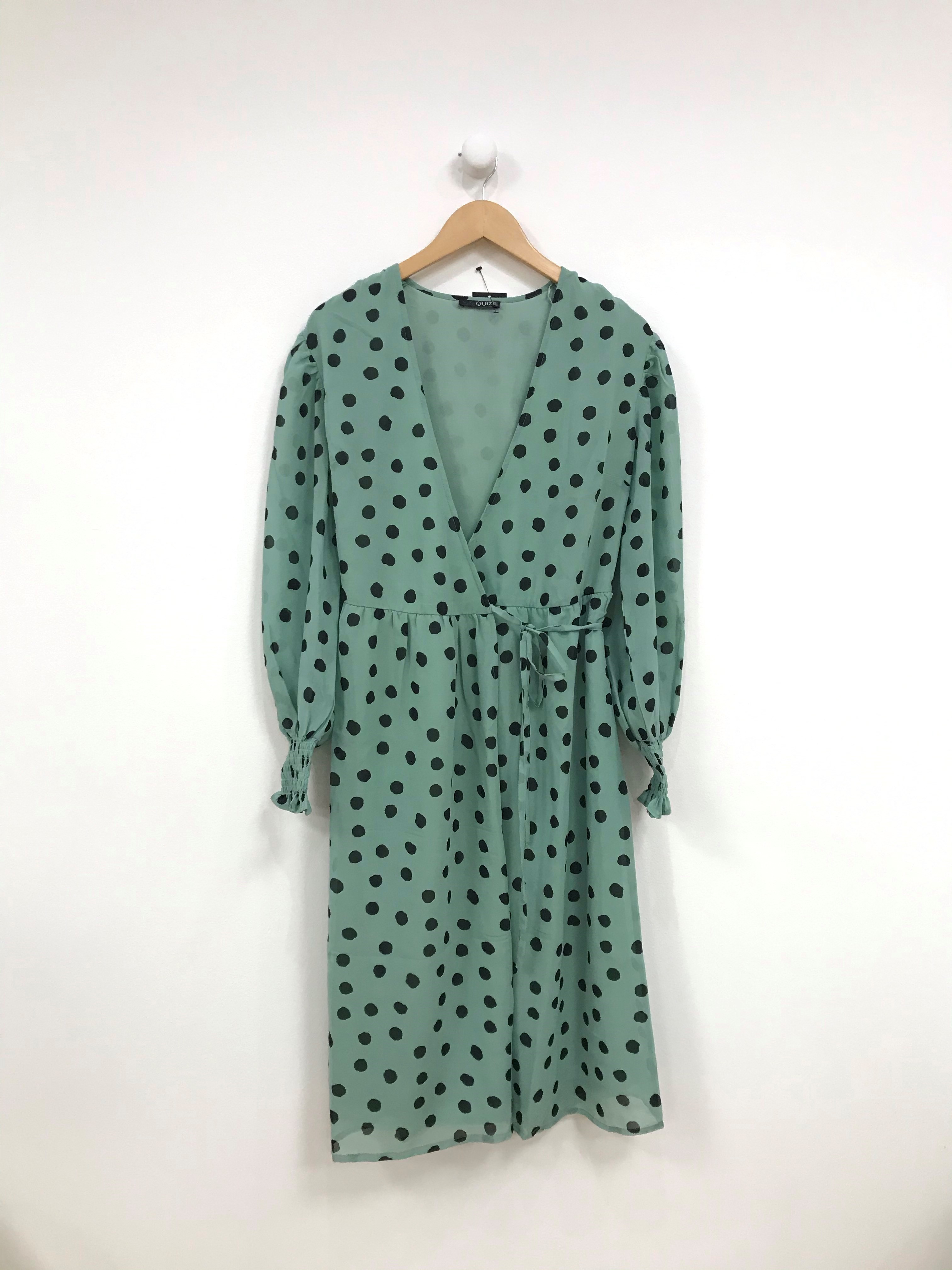 green dress with black polka dots