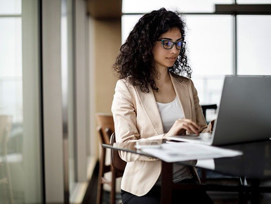 Person using computer to study curriculum