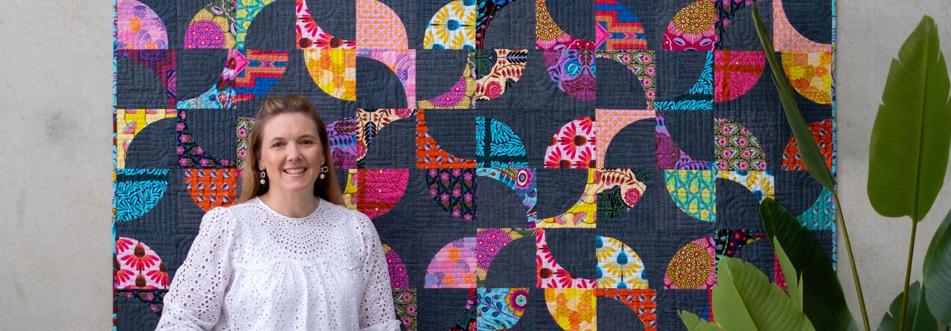 Jemima in front of quilt