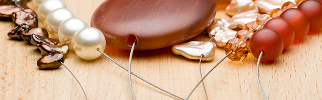 Image of pearls strung onto jewelry wire