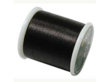 Strengthen designs with the KO nylon Japanese beading thread in black. Available on a 55 yard spool, this pre-waxed bead thread is ideal for using in seed bead embroidery and weaving. It makes stitching easier since it tangles and frays less. This also makes it easier to thread onto a needle. This thread features a black color that is ideal for pairing with dark colored beads. Try using it with black, silver or rich reds.Length 55 yds